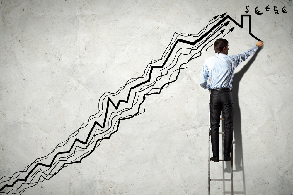 back,view,image,of,businessman,drawing,graphics,on,wall